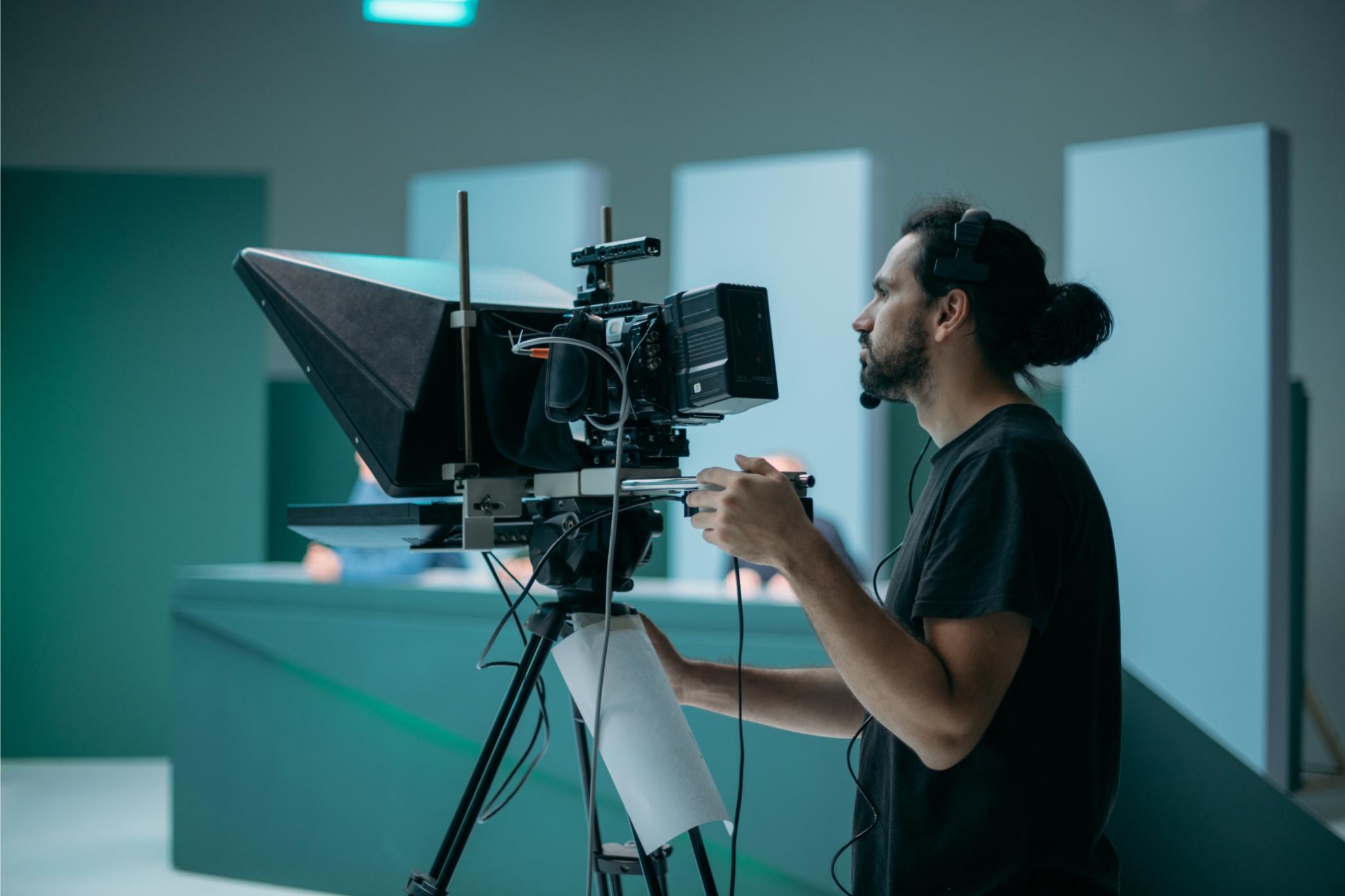 man operating a professional television camera 