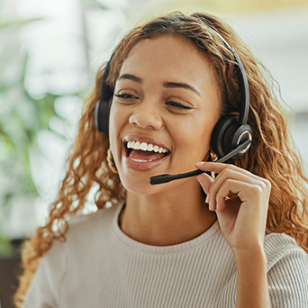 girl talking into the mic of a headset 