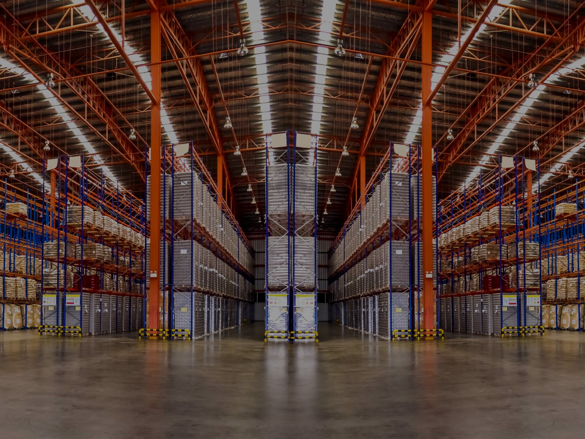 Warehouse aisles with shelves filled with boxes.