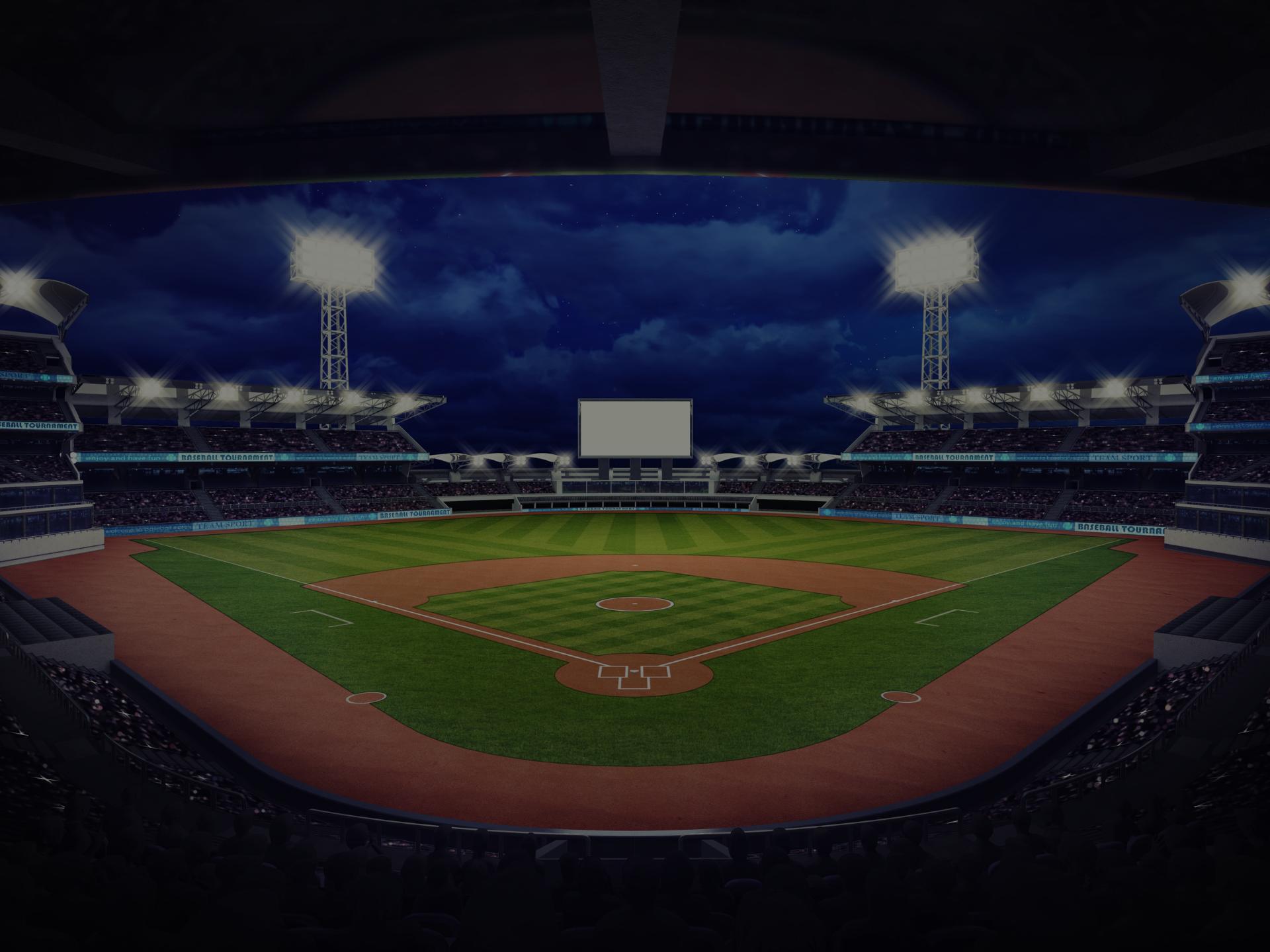 Empty baseball field in a baseball stadium at night. 