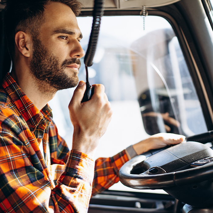 Truck driver talking on radio