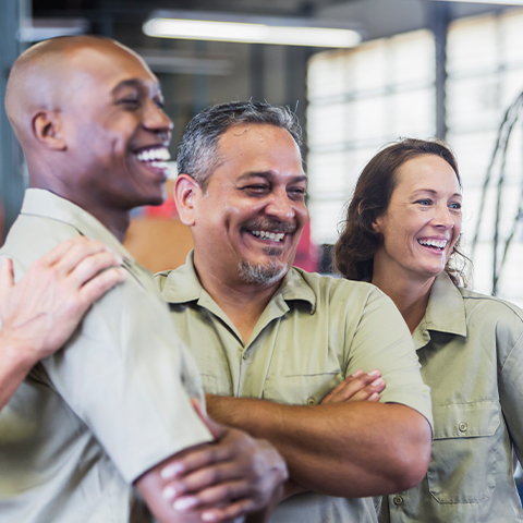 team huddle with team of workers